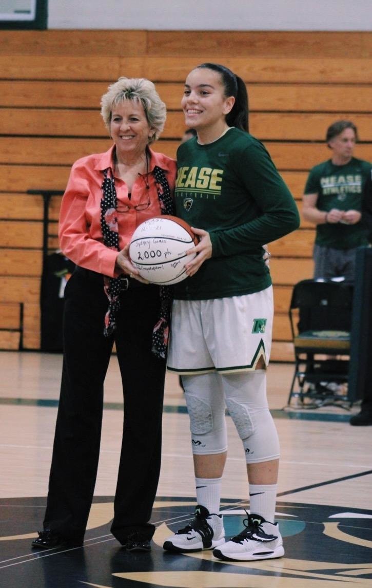 Sydney Gomes was recognized for reaching 2,000 career points, along with head coach Sherri Anthony on the court in front of the home fans prior to playing Menendez Dec. 13.